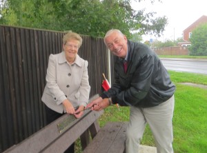 Borough Councillors Mary and Barry Coleman fixing the plaque.